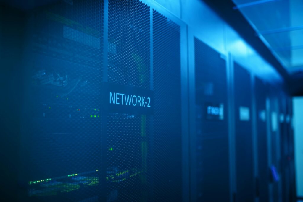 A modern server room featuring network equipment with blue illumination. Ideal for technology themes.